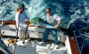 Deep sea fishing charter with mahi mahi, known locally as dolphin fish