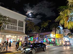 Cars driving Duval Street in Key West