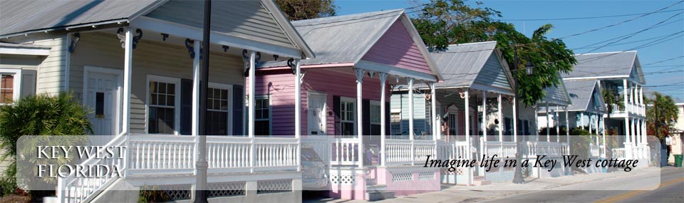 View of charming Key West cottages, painted in pasted colors