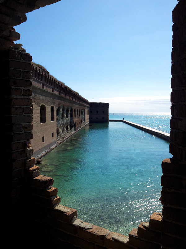 View through brick wall of the mote that surrounds Fort Jefferson in the Dry Tortugas