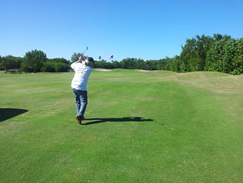 Golfer playing the Key West golf course