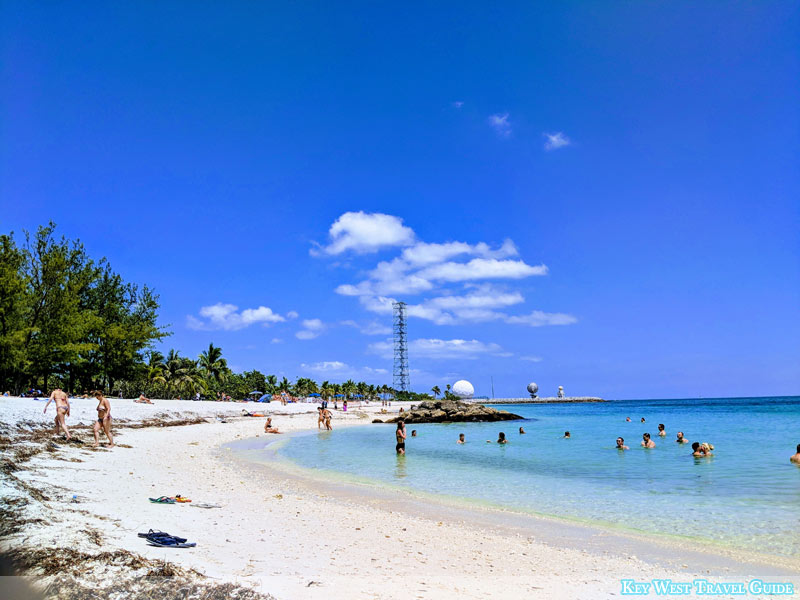 Photo of a day at the beach in Key West, with swimmers enjoying the calm and warm sea