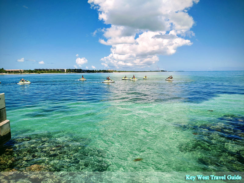 Blue skies and turquoise ocean while waverunners tour the island