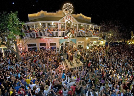 View of the New Year's celebration in Key West, with drag queen riding a huge shoe