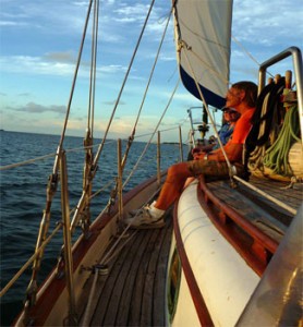 Private charter sailing along while passenger enjoys the memorable experience