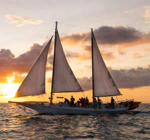 The traditional skipjack schooner, a working boat of Key West, as the sun goes down