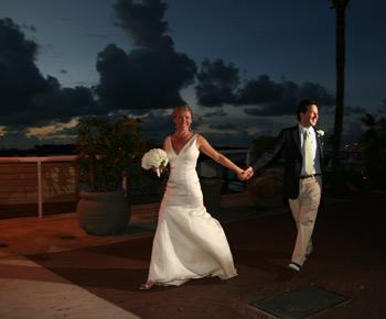 Happy couple, married in Key West, celebrates with a walk along the waterfront